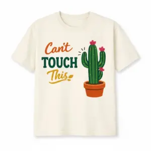 Ivory cactus shirt printed with CAN'T TOUCH THIS beside a flowering potted cactus graphic.