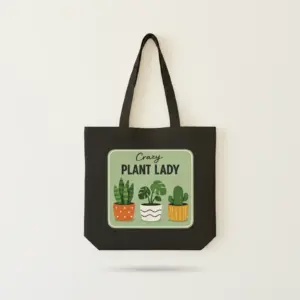 Black canvas tote bag with Crazy Plant Lady potted plants illustration printed on front.