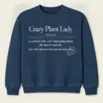 Blue jean crewneck sweatshirt with Crazy Plant Lady dictionary definition printed on the front.